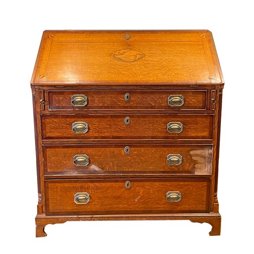 449 - A 19th century inlaid oak fall front bureau, with four graduating drawers below with brass swing han... 