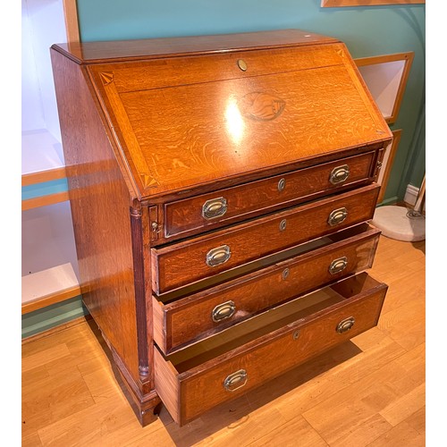 449 - A 19th century inlaid oak fall front bureau, with four graduating drawers below with brass swing han... 