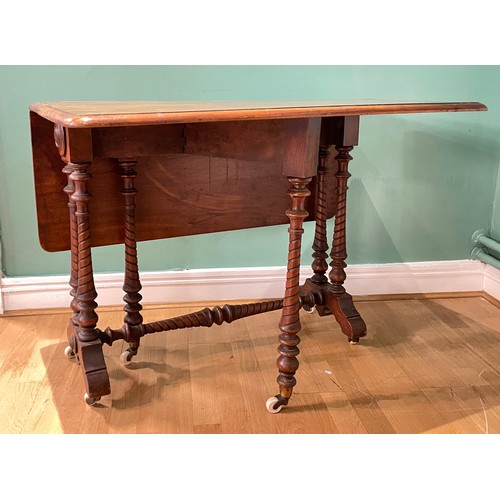 452 - A 19th century walnut Sutherland drop leaf gateleg table, raised on turned supports and turned stret... 