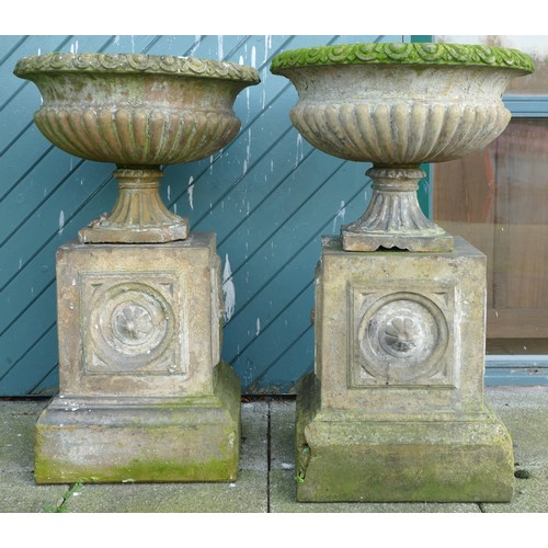 459 - A pair 20th century concrete garden urns, raised on carved rectangular plinth, 100cm high