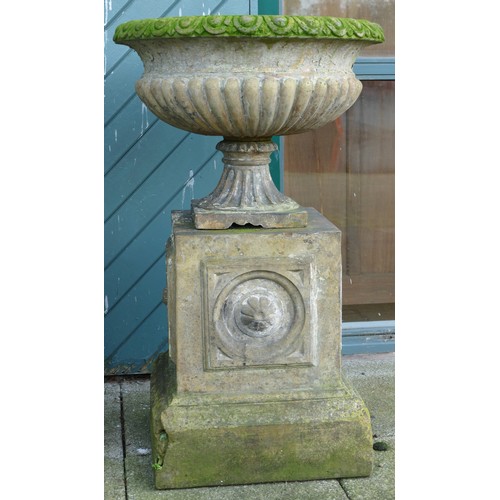 459 - A pair 20th century concrete garden urns, raised on carved rectangular plinth, 100cm high