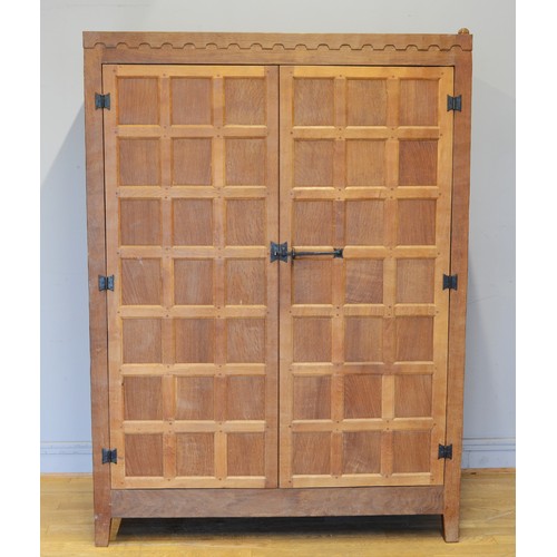 464 - Peter 'Rabbitman' Heap of Wetwang, a 20th century carved oak panelled twin door wardrobe/hall cupboa... 