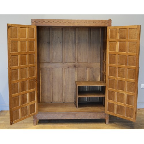 464 - Peter 'Rabbitman' Heap of Wetwang, a 20th century carved oak panelled twin door wardrobe/hall cupboa... 