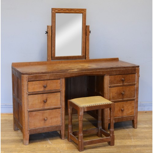 466 - Peter 'Rabbitman' Heap of Wetwang, a mid 20th century adzed oak mirror back twin pedestal dressing t... 