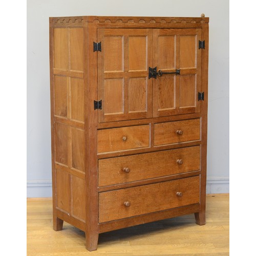 467 - Peter 'Rabbitman' Heap of Wetwang, a mid 20th twin door tallboy with two short over two long drawers... 