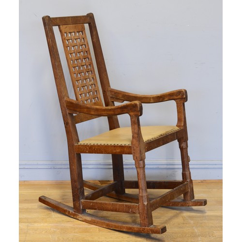 470 - Peter 'Rabbitman' Heap of Wetwang, a 20th century carved oak open arm rocking chair, with pierced la... 