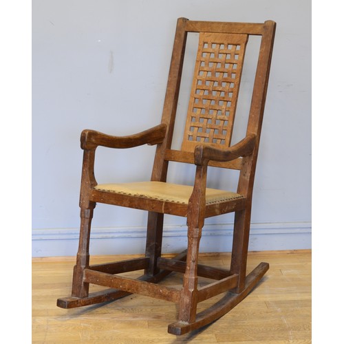 470 - Peter 'Rabbitman' Heap of Wetwang, a 20th century carved oak open arm rocking chair, with pierced la... 