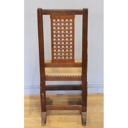 470 - Peter 'Rabbitman' Heap of Wetwang, a 20th century carved oak open arm rocking chair, with pierced la... 