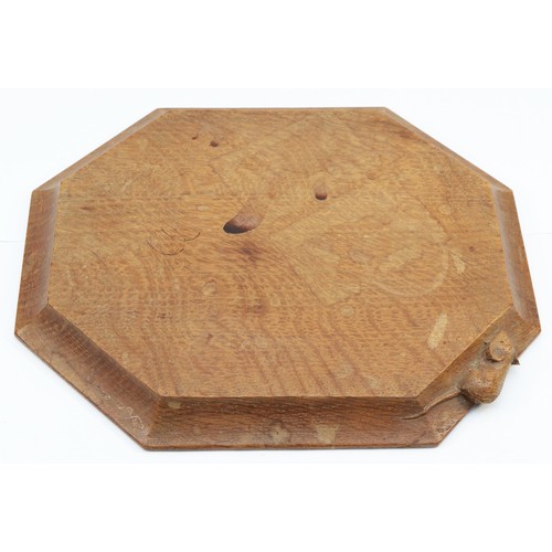 472 - Robert 'Mouseman' Thompson of Kilburn, a 20th century oak octagonal chopping board with carved mouse... 