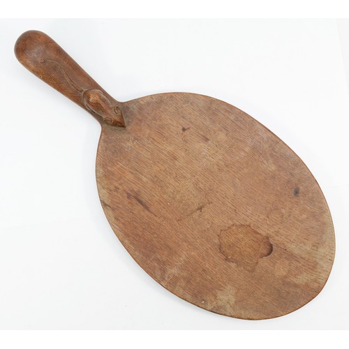 473 - Robert 'Mouseman' Thompson of Kilburn, a mid 20th century oval shaped cheeseboard, with carved mouse... 