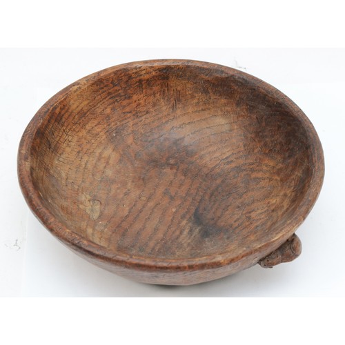 475 - Robert 'Mouseman' Thompson of Kilburn, an early/mid 20th century adzed oak circular bowl with carved... 