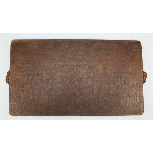 477 - Robert 'Mouseman' Thompson of Kilburn, an early/mid 20th century slightly adzed oak rectangular tray... 