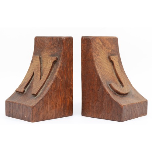 478 - Robert 'Mouseman' Thompson of Kilburn, a pair of mid 20th century carved oak adzed bookends, each wi... 