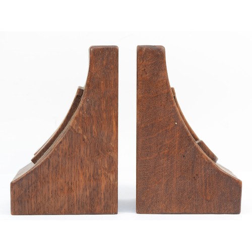 478 - Robert 'Mouseman' Thompson of Kilburn, a pair of mid 20th century carved oak adzed bookends, each wi... 