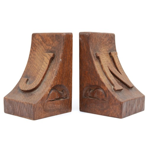 478 - Robert 'Mouseman' Thompson of Kilburn, a pair of mid 20th century carved oak adzed bookends, each wi... 