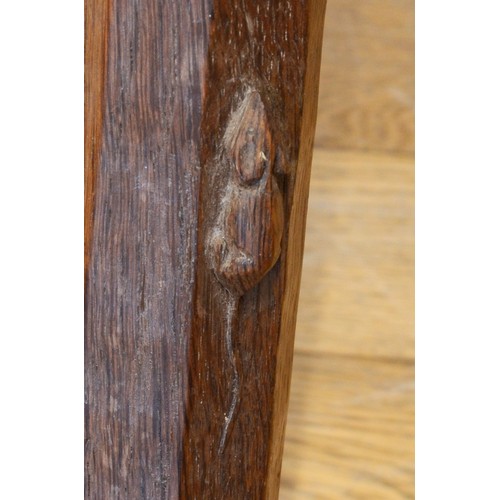 489 - Robert 'Mouseman' Thompson of Kilburn, a 20th century slightly adzed carved oak stool, with shaped s... 