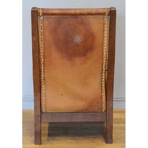 490 - Robert 'Mouseman' Thompson, a mid 20th century carved oak smoking chair with brown leather back and ... 