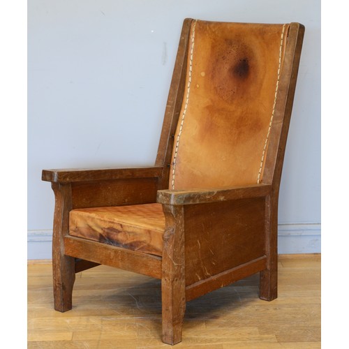 490 - Robert 'Mouseman' Thompson, a mid 20th century carved oak smoking chair with brown leather back and ... 