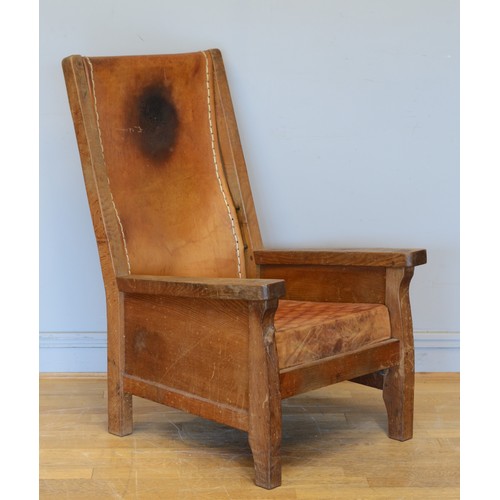 491 - Robert 'Mouseman' Thompson of Kilburn, a mid 20th century carved oak smoking chair with brown leathe... 