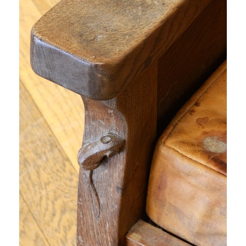 491 - Robert 'Mouseman' Thompson of Kilburn, a mid 20th century carved oak smoking chair with brown leathe... 