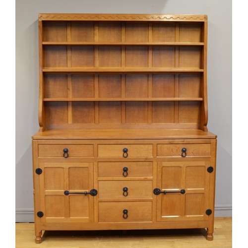 492 - Robert 'Mouseman' Thompson of Kilburn , a adzed oak Welsh dresser, c1980s, with three shelf plate ra... 