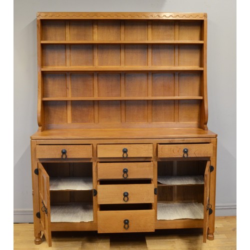 492 - Robert 'Mouseman' Thompson of Kilburn , a adzed oak Welsh dresser, c1980s, with three shelf plate ra... 