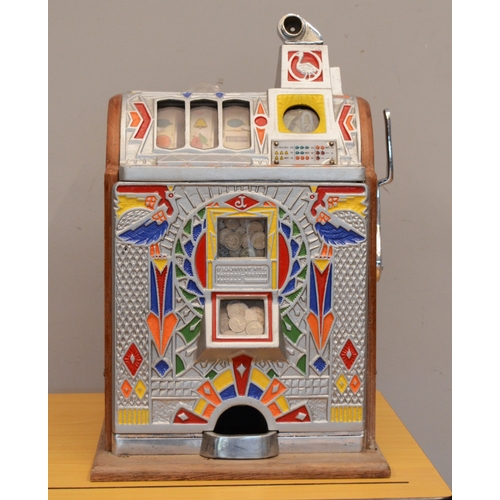 504 - O.D. Jennings, a Peacock doble jackpot mechanical slot machine, c.1932, aluminium case, 62 x 38 x 37... 