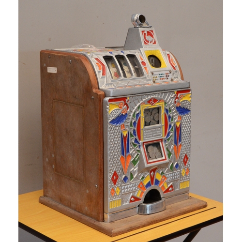 504 - O.D. Jennings, a Peacock doble jackpot mechanical slot machine, c.1932, aluminium case, 62 x 38 x 37... 