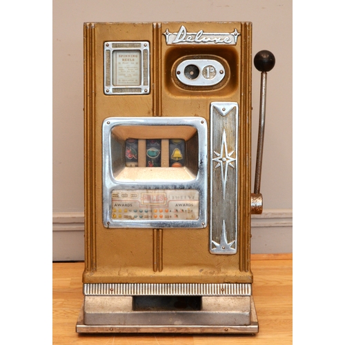 505 - Deluxe, a mechanical three reel slot machine, c.1960's, aluminum case plays 1d, 68 x 40 x 40cm.
No b... 