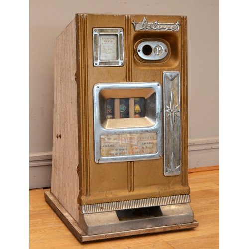 505 - Deluxe, a mechanical three reel slot machine, c.1960's, aluminum case plays 1d, 68 x 40 x 40cm.
No b... 