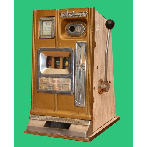 505 - Deluxe, a mechanical three reel slot machine, c.1960's, aluminum case plays 1d, 68 x 40 x 40cm.
No b... 