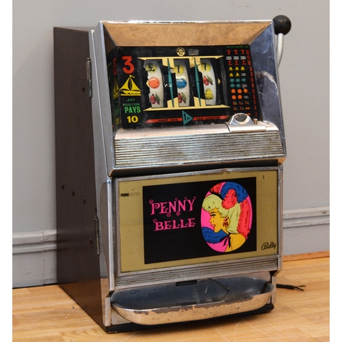 507 - Penny Belle by Bally, an electro-mechanical three reel slot machine, c.1960's, 65 x 40 x 40cm.
Key, ... 