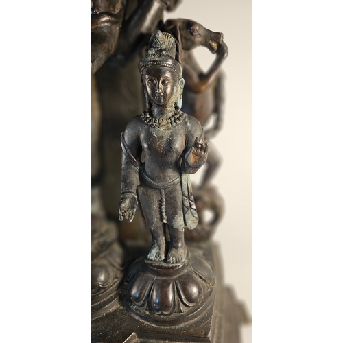 298 - A large Thai bronze statue group of Deities, the back section removeable, 100cm