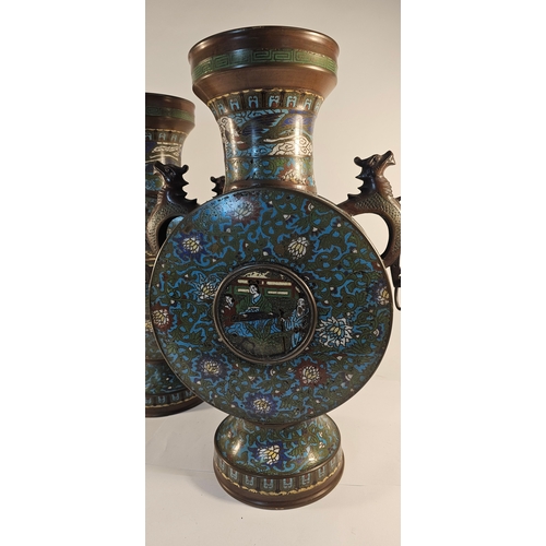 289 - A pair of early 20th century Chinese bronze and enamel moon vases, with elephant handles, 54cm