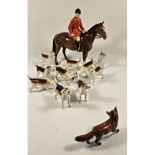 288 - Beswick huntsman on horse figurine, together with ten hunting hounds and a fox, four dogs with resto... 