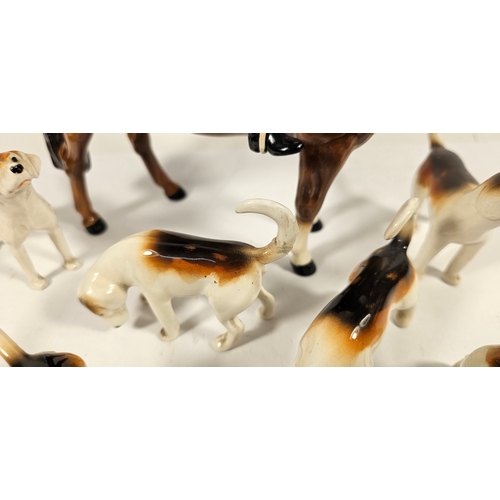 288 - Beswick huntsman on horse figurine, together with ten hunting hounds and a fox, four dogs with resto... 