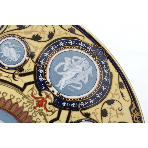 283A - A 19th century, Ludwigsburg porcelain charger with central roundels of Pate sur Pat style decoration... 