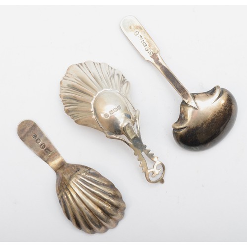 31 - A George III silver bright cut caddy spoon, Birmingham 1799, a George III silver shell bowl caddy sp... 