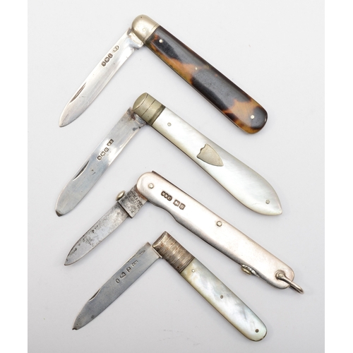 53 - A George IV silver and mother of pearl fruit knife, Sheffield 1823, two others Sheffield 1928 and 19... 