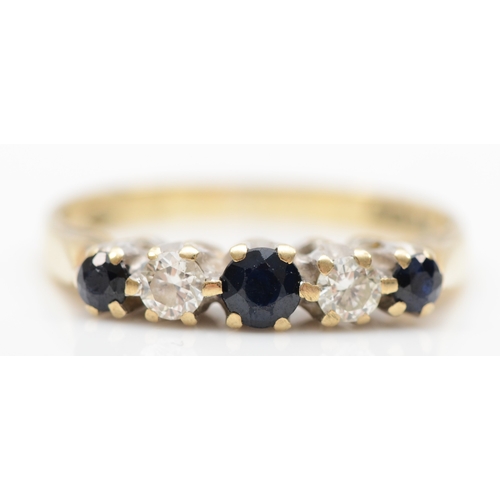 384 - A 9ct gold graduating five stone sapphire and brilliant cut diamond ring, J, 1.9gm.