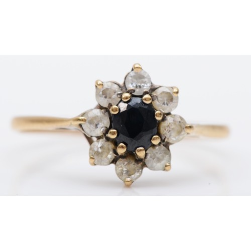 386 - A 9ct gold sapphire and CZ cluster ring, N, 1.3gm