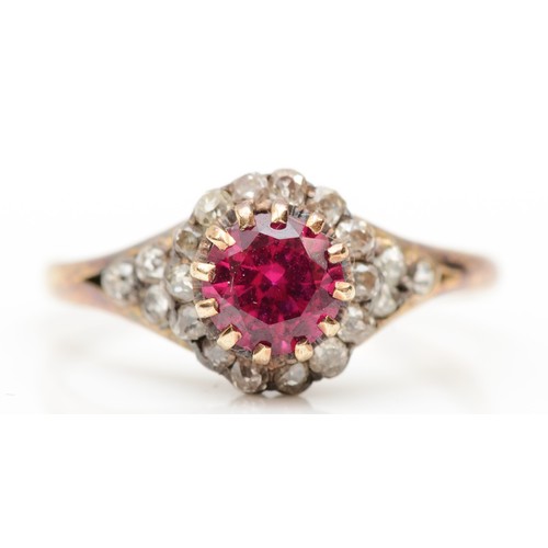 390 - An unmarked 18ct gold ruby and old cut diamond cluster ring, claw set circular 6mm stone, with diamo... 