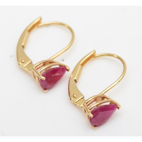 403 - A 14ct gold pair of synthetic ruby ear rings, 0.9gm