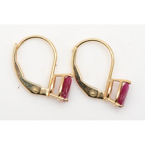 403 - A 14ct gold pair of synthetic ruby ear rings, 0.9gm