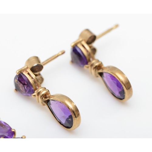 417 - A 9ct gold and amethyst drop ear pendants, 20mm and another pair of amethyst ear rings, 4.1gm