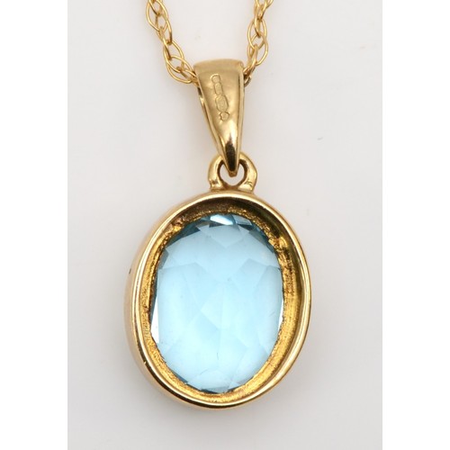 425 - A 9ct gold mounted topaz pendant, stone 11 x 9mm, chain 46cm, 2.4gm