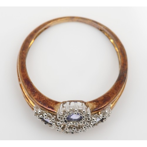 430 - A 9ct gold tanzanite and diamond cluster ring, N, 2.6gm