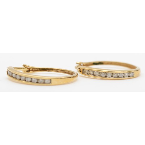 447 - A 9ct gold pair of brilliant cut diamond hoop ear rings, 1.6gm