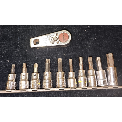 A Snapon ratchet, F734, five Snapon star sockets and five other sockets