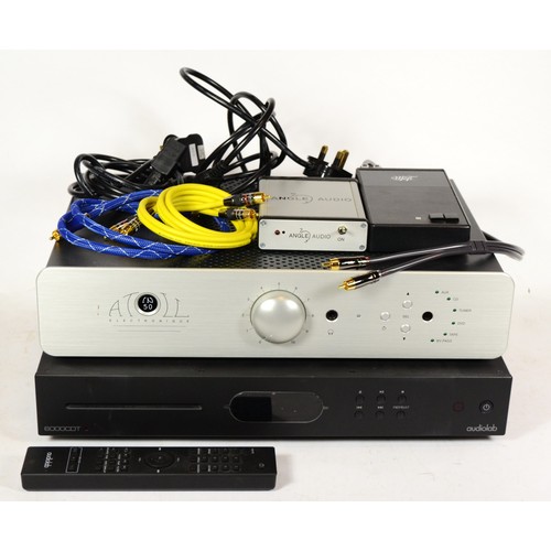 121 - An Audiolab CD/DVD player 6000 series, boxed with remote, together with a Atoll amplifier, model 1N ...